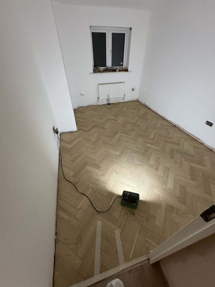 Herringbone floor being laid