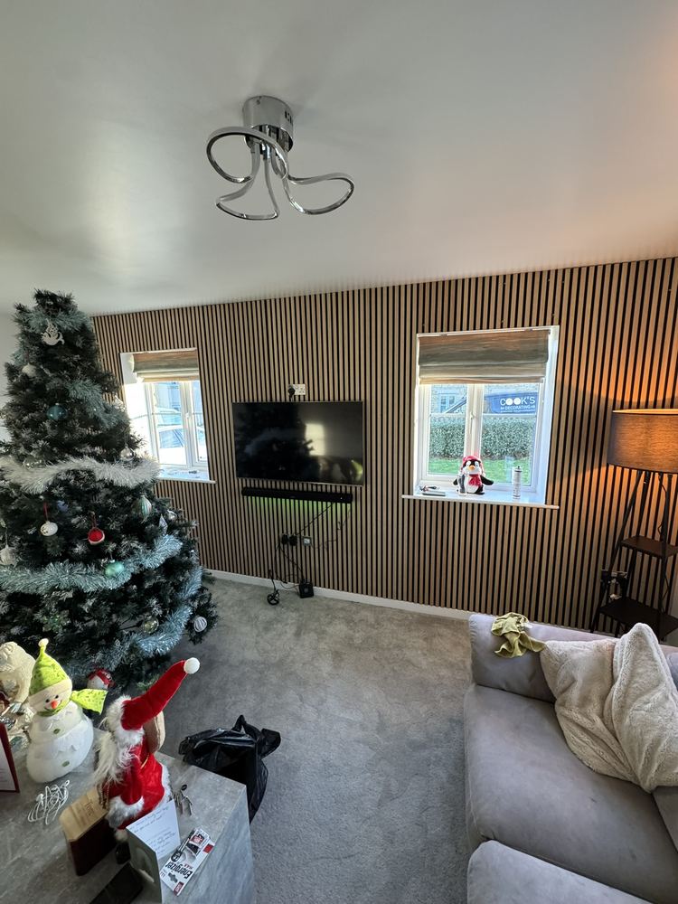 Slatted wood media wall with wall-mounted TV